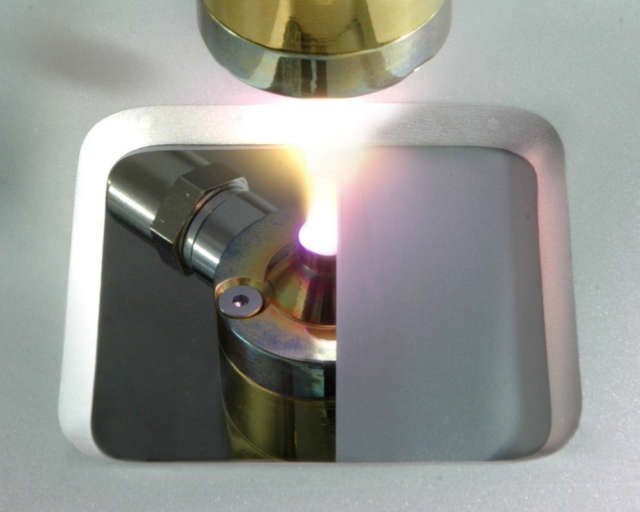Coating deposition by cold plasma spraying at the Fraunhofer IST: Nozzle with plasma jet of a system for cold plasma spraying.