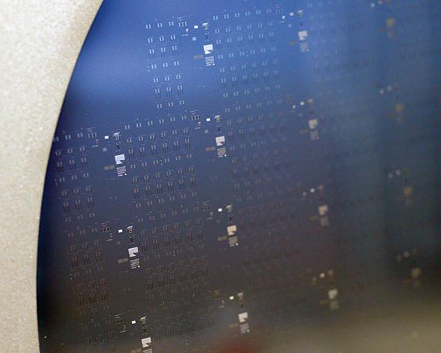 Successful deposition of nanocrystalline silicon on 8" silicon wafer with etched contact points.