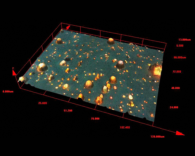 Aufnahme mit dem konfokalen Lasermikroskop (CLM) von Partikeln auf einer Oberfläche.