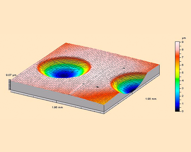3D representation of a crater in a DLC layer made using a profilometer.