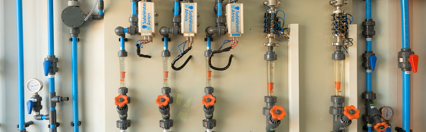 Disinfection unit of the demonstrator with three electrochemical cells with diamond electrodes connected in parallel (housing inscription “SafeWaterAfrica”).