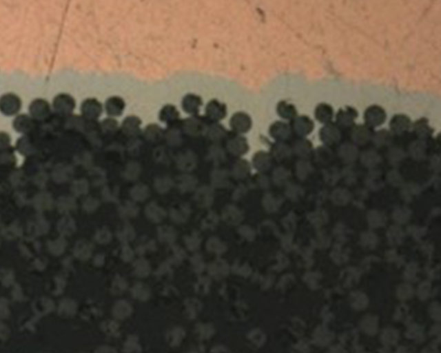 Cross-section of a metallized CFRP sample.