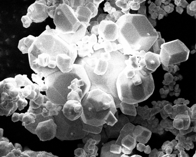 Variety of materials in plasma particle technology: Microscope image of cubic tungsten particles.